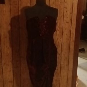 A Beautiful burgundy velvet strapless dress.